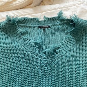 Gorgeous turquoise sweater with fringe!